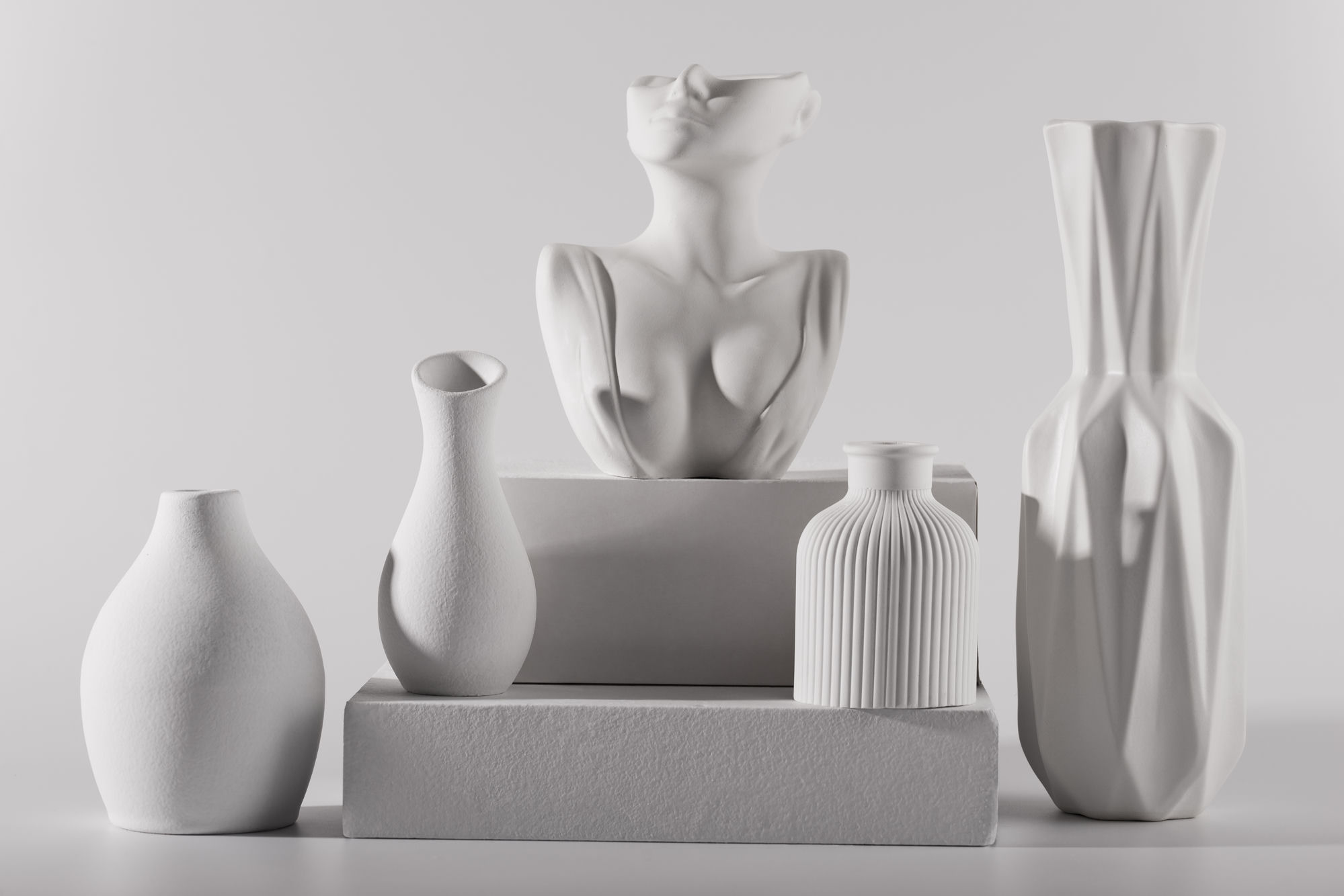 Large marble sculpture in a dramatic dark gallery